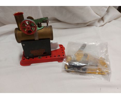 A box containing a Mamod Minor No. 2 stationary engine - sold with a bag containing a small quantity of Meccano parts