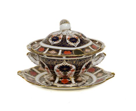 A Royal Crown Derby Imari sauce tureen, cover and stand moulded with acorns, pattern 1128, printed marks, date codes for 1988