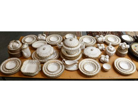 A Spode dinner, tea and coffee service in the Fleur de Lys Gold pattern, including soup tureen, pair of vegetable tureens, te