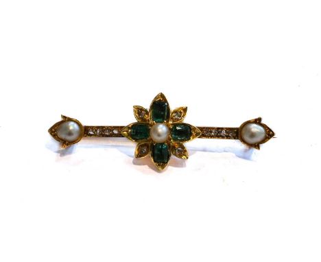 An emerald, split pearl and diamond brooch, the central floral motif composed of a split pearl within a border of cushion cut