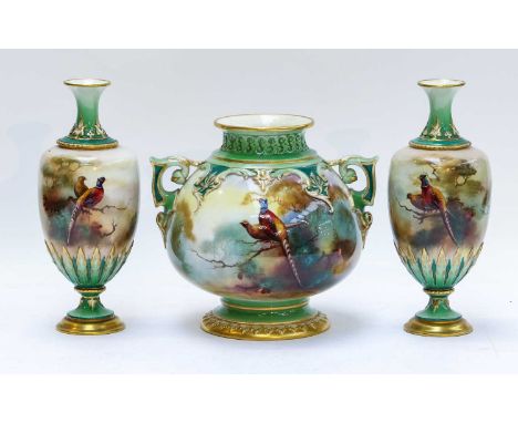 A garniture of three Royal Worcester Hadley Ware vases by Albert Shuck and Arthur Lewis, with green and gilt borders framing 