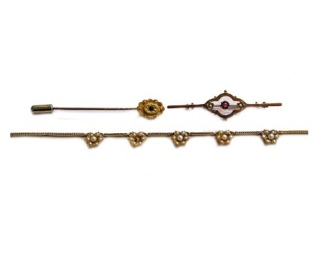 An Edwardian split pearl necklace, clasp stamped '15CT', length 39.5cm (a.f.), a split pearl and ruby brooch, stamped '9CT', 