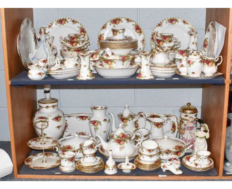 An extensive collection of Royal Albert "Old Country Roses" dinner wares including dinner plates, cups and saucers, lamps, te