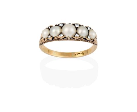 A split pearl and diamond ring, five graduated split pearls spaced by rose cut diamond accents, in yellow claw settings, with