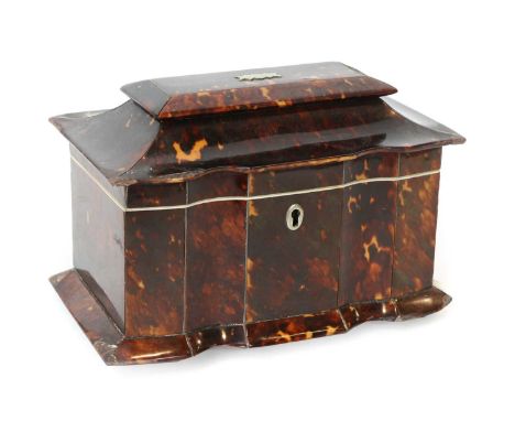 A Regency Tortoiseshell tea caddy with pagoda top, scalloped front, and two lidded compartments All four feet detached but re