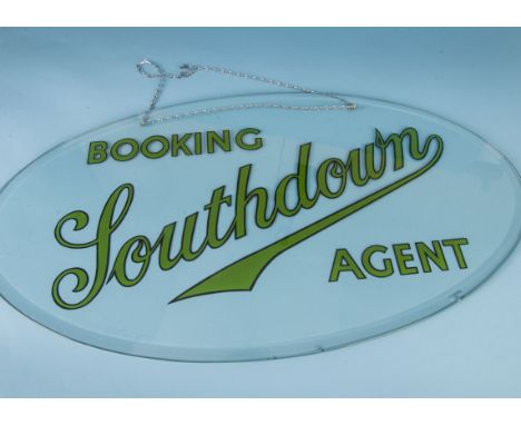 A vintage oval glass travel agents Southdown Bus advertising sign, printed to reverse with Booking Southdown Agent, 76cm wide