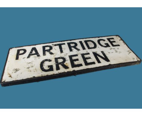 A vintage town road sign, "Partridge Green", pressed aluminium with raised lettering and border, 46cm x 122cm.