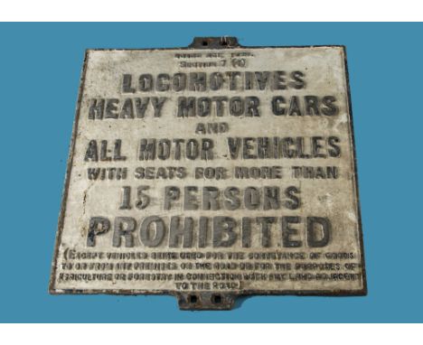 A vintage cast Iron 1920 Road Act sign, Heavy vehicles and Locomotives, with prohibited vehicles listed with seats of more th