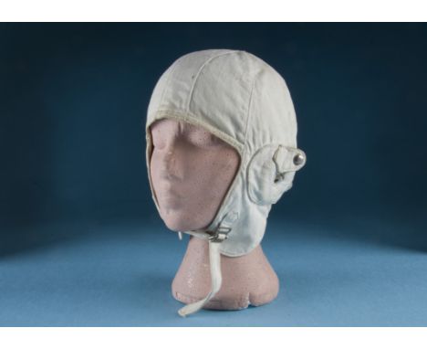 Aviators Windcap – An interwar period flying-helmet c1920s; light cloth fabric with buckle chinstrap.  