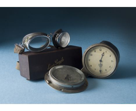 Three vintage Motoring items, including a pair of Luxor goggles in original box with leaflet, a Smiths dashboard clock and an