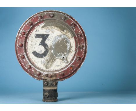 A vintage '30 MPH' speed limit sign, circular, with inset red " cats eye" reflectors to outer ring and painted centre (30 mis