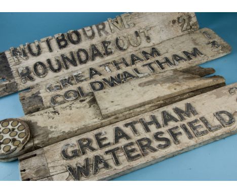 A group of three vintage wooden sign post arms, various locations with distance milage indicators including Greatham, Watersf