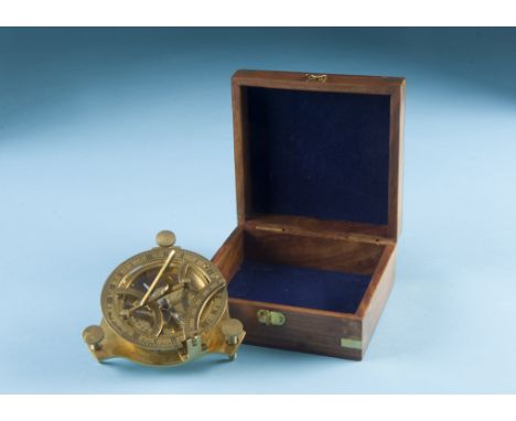 A modern brass compass and sun dial, circular with folding sundial to upper, marked West London, in square box (2) 