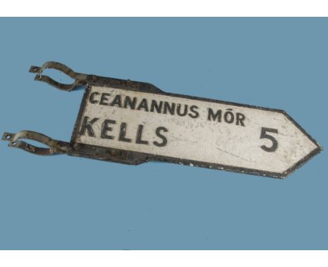 A vintage Irish road sign, double sided arrow with clamps, stating "Ceanannus Mor Kells 5", 29cm by 97cm