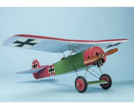 A scatchbuilt model of a Fokker D.VIII, a flying/ gliding scale model, finished in red over green with national markings of t