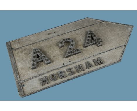 A vintage directional road sign, for "Horsham A24" , in cast aluminium with clear "cats eye" reflector inserts, oblong with p