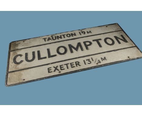 A vintage town road sign, in cast aluminium, "Cullompton" with Exeter 13. 1/4m and Taunton 19m named below and above, 114.5cm