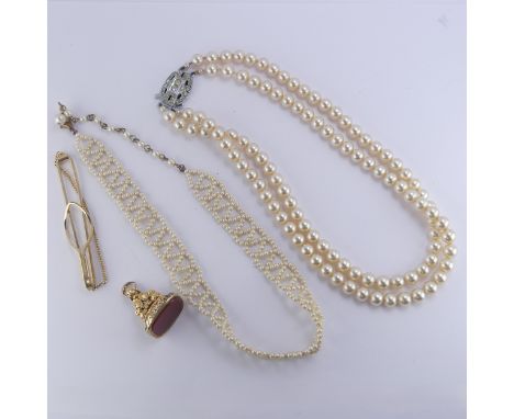 A 19thC gold plated Fob Seal,&nbsp;with vacant carnelian matrix,&nbsp;together with a string of lotus pearls, Edwardian seed 
