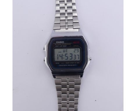 A retro Casio digital stainless steel Wtistwatch, ref. 3299, with branded stainless steel bracelet strap, running, together w