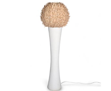 A large mid-century sea urchin design floor lamp, the tapered cylindrical base supporting a large coconut shard shade, in wor