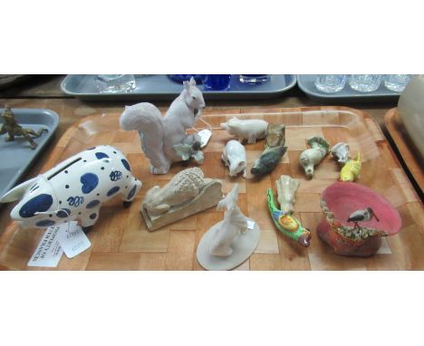 Selection of ceramic animals to include: a white rat with a broken tail, a pig, a squirrel, a plaster lion resembling Aslan, 