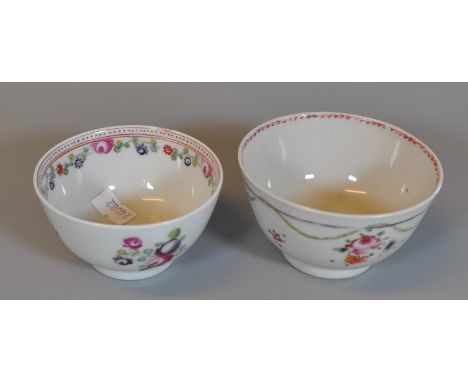 Two similar 18th Century porcelain tea bowls with hand painted enamelled flowers, possibly New Hall. (2) (B.P. 21% + VAT) 