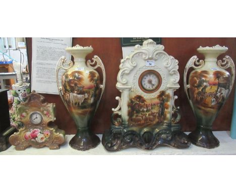 Early 20th Century Staffordshire pottery clock garniture set comprising; large mantel clock and a pair of two handled vases d