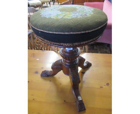 Late Victorian carved oak and tapestry circular footstool.(B.P. 21% + VAT) 