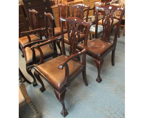 A set of six mahogany Chippendale style dining chairs with leather drop in seats, standing on cabriole legs and ball and claw