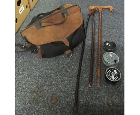 Collection of items to include three wooden walking stick, one with a bird terminal, suede fishing or hunting bag together wi