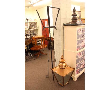 Copper and glass lantern with wrought iron stand and lantern top.