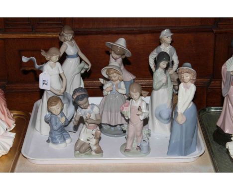 Two Lladro girl figures and eight Nao figures.