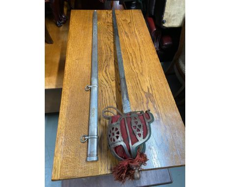 Antique Cavalry sword and scabbard, designed with an etched blade. 