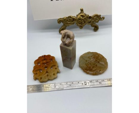 A Lot of three Chinese hardstone and Jade carvings. Which includes an ox topped seal. 