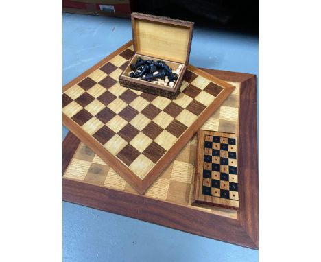 Two vintage wooden chess boards together with a classic Staunton design chess pieces. Lot also includes pocket chess set. 