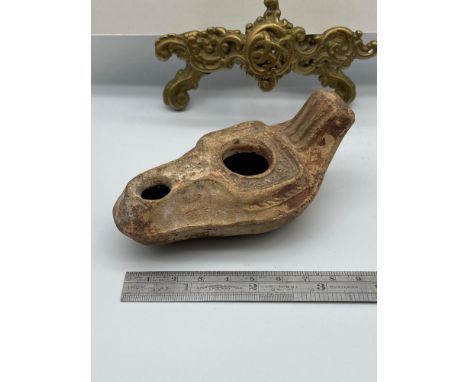 An Ancient Roman oil lamp. [9.5cm length] 