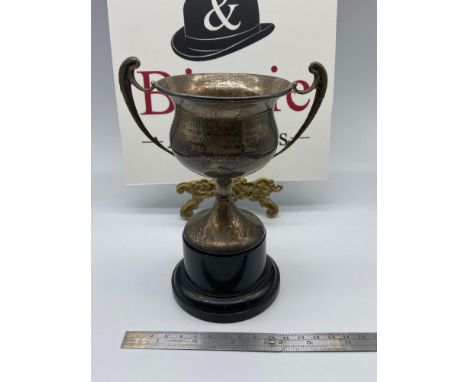 A Vintage Sheffield silver golf trophy cup. Designed with two handles and plastic style base. Engraved 'Ahmadi Golf Club, Wil