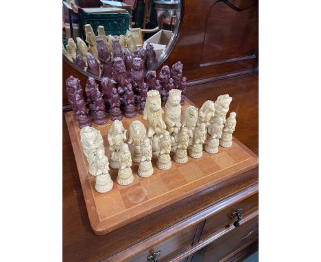 A Vintage wooden chess board together with animal character chess pieces. 