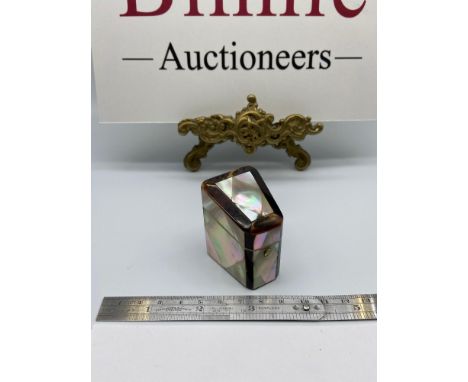 A Victorian Mother of pearl and tortoise shell thimble holder. Together with a Sterling silver thimble. 