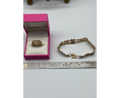 A Ladies 9ct gold gate bracelet and a 9ct gold and diamond ring [Ring size 0 1/2] [8.31Grams] 