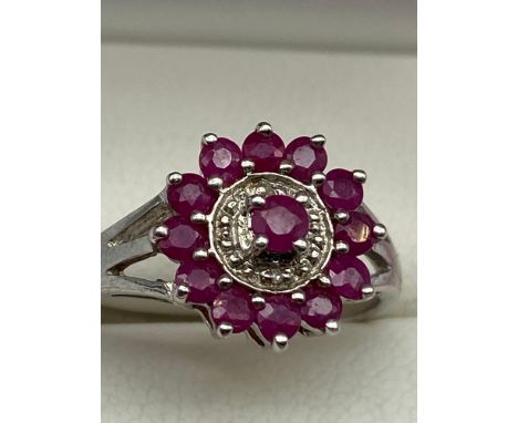 A Lovely example of a ladies 925 silver, Ruby and diamond dress ring. [Ring size O] 