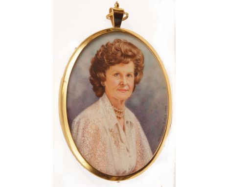 *WILLIAM P MUNDY, RMS, FSCD (BORN 1936, BRITISH)Portrait of Mrs Joan Patricia Carterwatercolour miniature, signed and dated 1