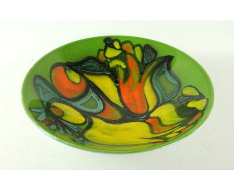 A large Poole pottery Delphis bowlHaving multi-coloured stylised decoration on a green ground, factory marks to base, height 