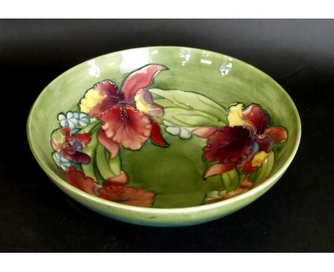 A Walter Moorcroft bowl of circular formDecorated in the 'Orchid' pattern on a green ground, height 9.5cm, diameter 31cm    C