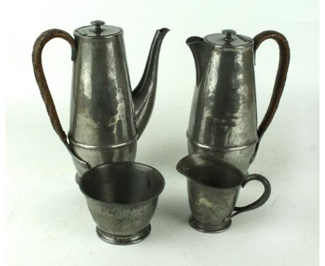 An English Pewter four piece tea serviceMade by Liberty & Co, comprising hot water pot, teapot, milk jug and sugar bowl, numb