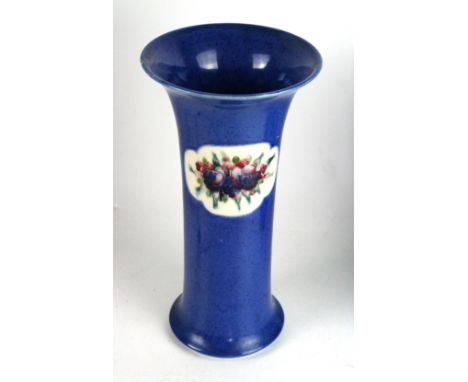 A William Moorcroft vase of trumpet formDecorated in the 'Fruit and Flowers' pattern on a powder blue ground, green signature