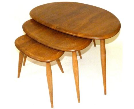 A set of vintage Ercol 'Pebble' light elm coffee tablesCirca 1950's, height of largest example 40cm, length 65cm 