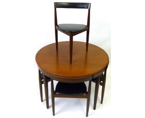 A mid Century Frem Rojle Hans Olsen Danish teak circular topped dining tableThe circular topped table having one extra leaf, 