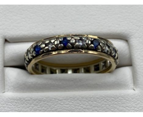 Ladies yellow gold sapphire and white stone full eternity band, size K 2.4grm