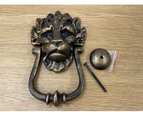 A reproduction cast metal 10 Downing Street knocker in the form of a lion